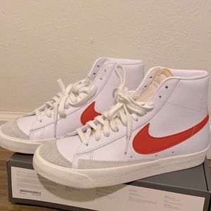 Nike blazers. Orange & white.